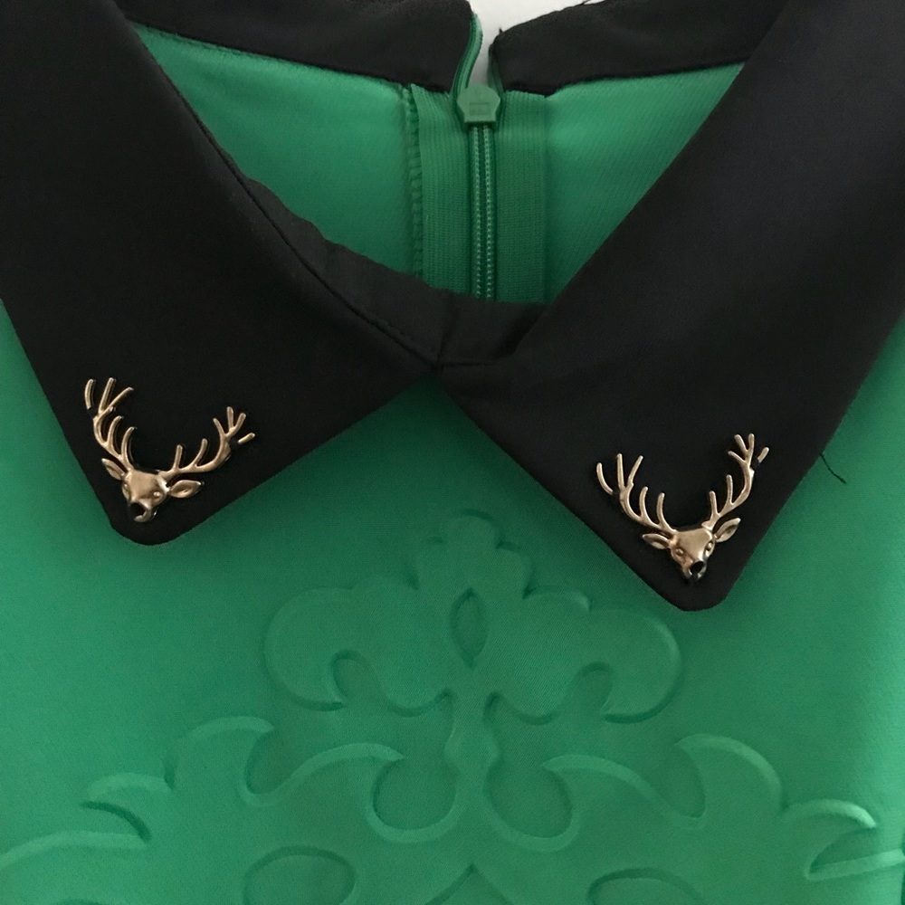 Green embossed top w/ stag/deer collar ornaments